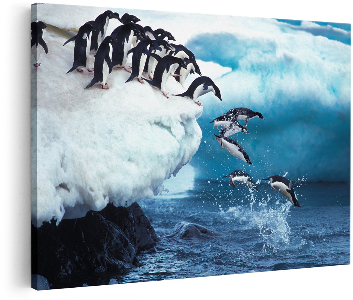 Artaza Canvas Schilderij Kudde Pinguïns Springen vanaf een Rots - 150x100 cm - Groot - Wanddecoratie Woonkamer - Schilderijen - Muurdecoratie