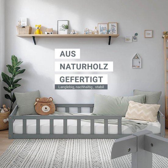 Duurzaam peuterbed uit natuurhout in grijs, met tekst over duurzaamheid en stabiliteit in de kamer.