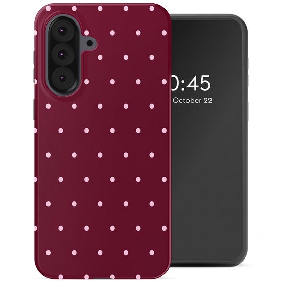 Coque de téléphone bordeaux à pois roses à côté d'un smartphone à écran noir.