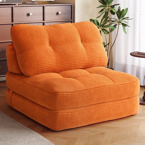 Oranje corduroy fauteuil met knopen en geribbelde stof.
