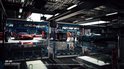 Een garage met meerdere sportwagens, inclusief rode en blauwe modellen.
