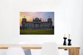 Canvas Schilderij Het Rijksdag-gebouw tijdens een schemering in Duitsland - 90x60 cm - Wanddecoratie