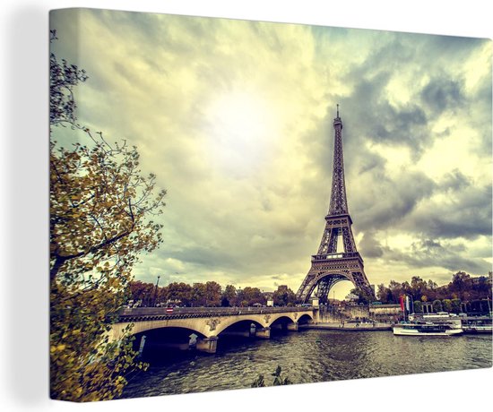 Canvas schilderij 140x90 cm - Wanddecoratie Uitzicht over het water op de Eiffeltoren en Parijs - Muurdecoratie woonkamer - Slaapkamer decoratie - Kamer accessoires - Schilderijen