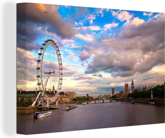 Canvas schilderij 140x90 cm - Wanddecoratie Witte wolkenformatie boven de London Eye in Londen - Muurdecoratie woonkamer - Slaapkamer decoratie - Kamer accessoires - Schilderijen