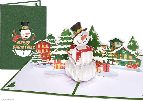 Popcards pop-up kaart – Pop-up Kerstkaart Grote Sneeuwpop met besneeuwde dennenbomen en kersthuisjes Sneeuw pop-up kaart 3D wenskaart
