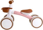 Roze loopfiets met bruine handvatten, zadel en mandje, op een witte achtergrond.