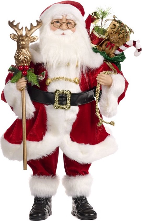 Père Noël avec bâton de renne et grand sac plein de cadeaux, vêtu de velours rouge et blanc.