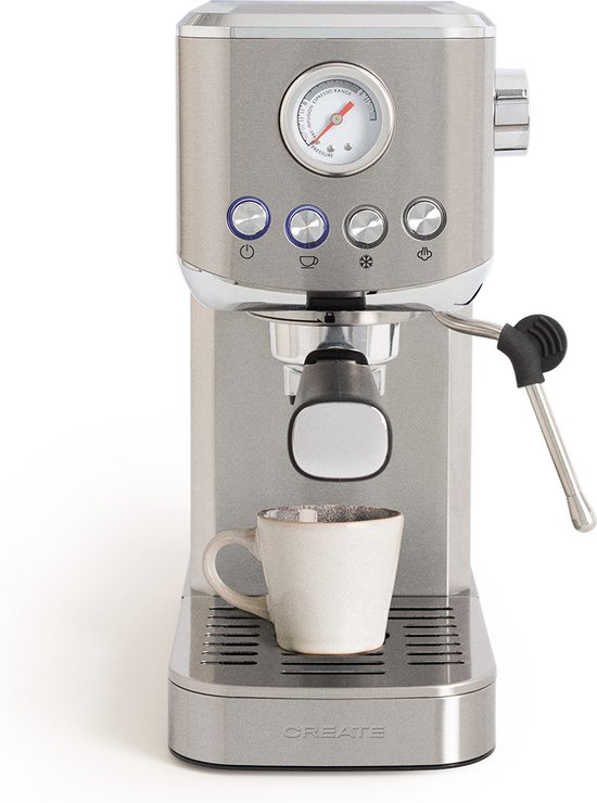 Zilverkleurige espressomachine met een manometer, bedieningsknoppen en een ingebouwde mok.