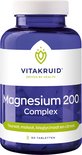 Blauwe pot met een wit deksel, etiket met "Vitakruid Magnesium 200 Complex" en "90 Tabletten".