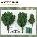 Composants d'un sapin de Noël artificiel : parties de l'arbre, support, éclairage, télécommande et un sac de rangement vert.