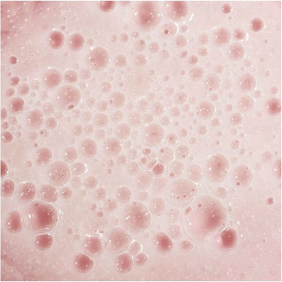 Close-up van roze, schuimende bubbels.