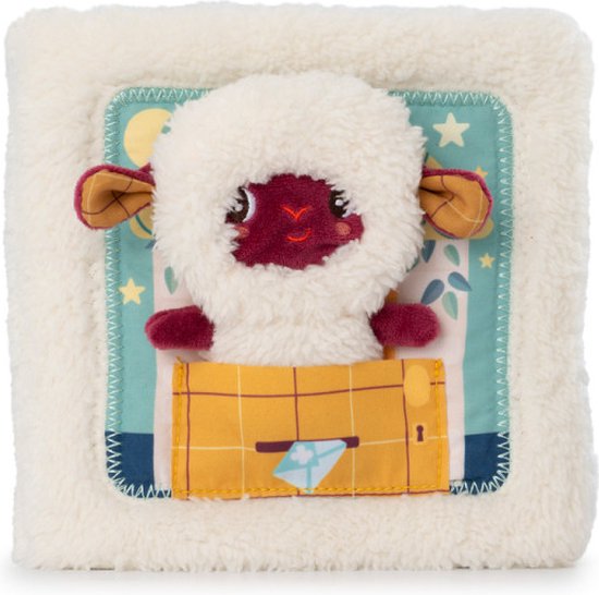 Wit stoffen babyboekje met schaapje Yvon die slaapt in een bedje onder een sterrenhemel.