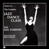 Femme en robe noire fendue, bras levés, devant le texte 'Music For... The Complete JAZZ DANCE CLASS With LEA DARWIN'.