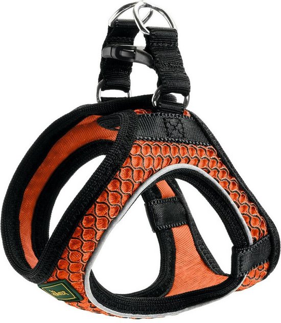 Harnais orange pour chien avec motif nid d'abeille et accents noirs. Possède deux ouvertures pour les pattes et des sangles réglables.