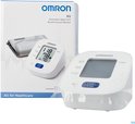 Omron M2 bloeddrukmeter met manchet en doos. Het scherm toont 118/78 en 70.