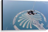 Canvas - Parachutespringer boven de Palm van Dubai - 90x60 cm Foto op Canvas Schilderij (Wanddecoratie op Canvas)