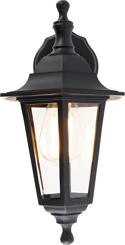 Zwarte klassieke wandlamp met glazen panelen en zichtbare gloeilamp.