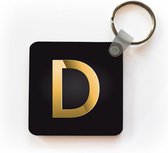 Sleutelhanger - Uitdeelcadeautjes - Een illustratie van de letter D in het goud - Plastic