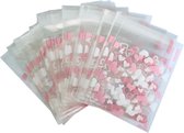 Fako Bijoux® - Cellofaanzakjes - 100x Uitdeelzakjes - Cellofaan Plastic Traktatie Kado Zakjes - Snoepzakjes - Hartjes Roze/Wit - 7x7cm