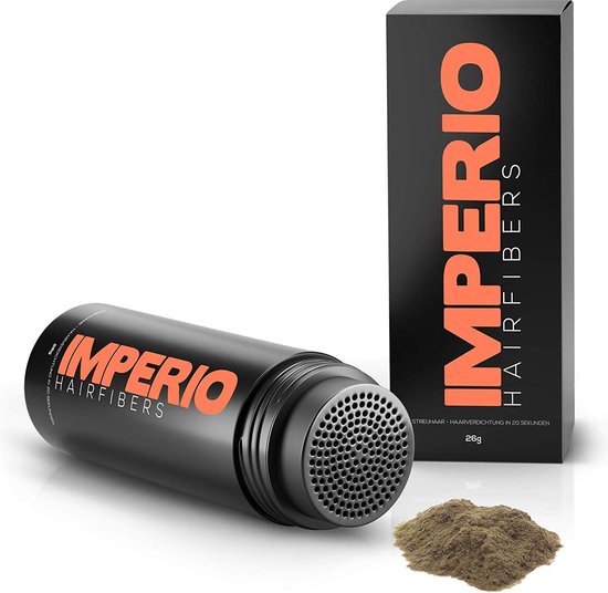 Zwarte Impero Hairfibers fles met oranje logo, naast een doosje en een hoopje haarvezels.