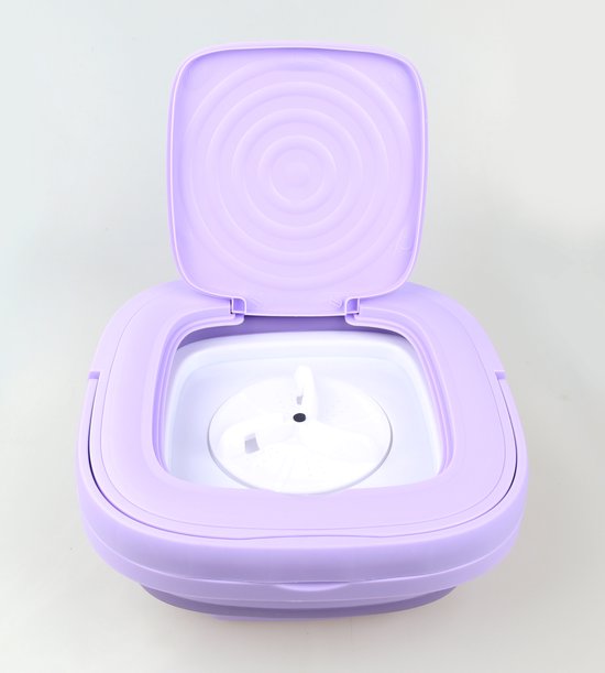 Paarse mini-wasmachine met open deksel, tonen de binnenkant met een witte centrifuge.