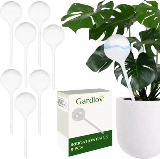 Balles d'irrigation Gardlov : huit distributeurs d'eau blancs, avec une grande plante en arrière-plan.