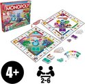 De doos en het speelbord van Monopoly Junior, met speelstukken, geld en kaarten.