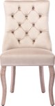 Beige fluwelen eetkamerstoel met hoge rugleuning en knopen-quilting. Houten poten.