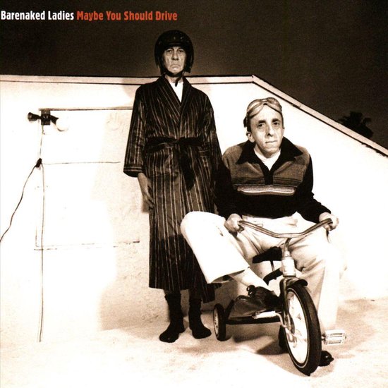 Twee mannen, één met helm en badjas, de ander met skibril en op een driewieler. Albumhoes "Maybe You Should Drive".