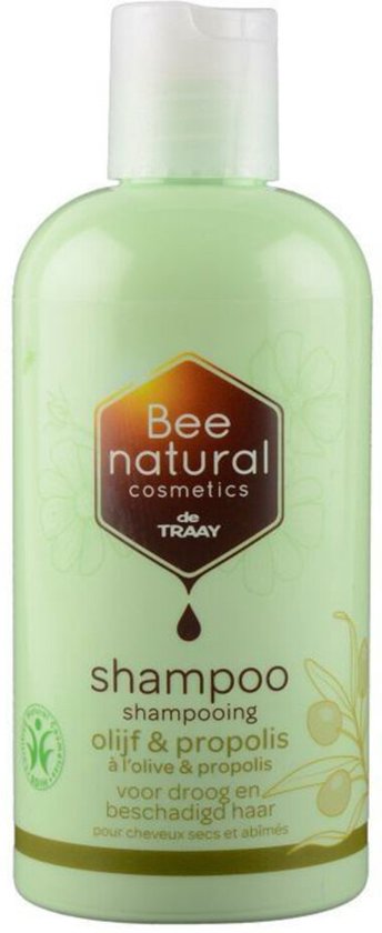 Lichtgroene fles shampoo van Bee Honest, met een honingraatlogo. Het label toont "shampoo olijf & propolis" en olijftakken.