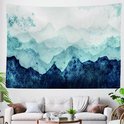 Tenture murale avec paysage de montagne aquarelle dans des tons de bleu et blanc, accrochée au-dessus d'un canapé.