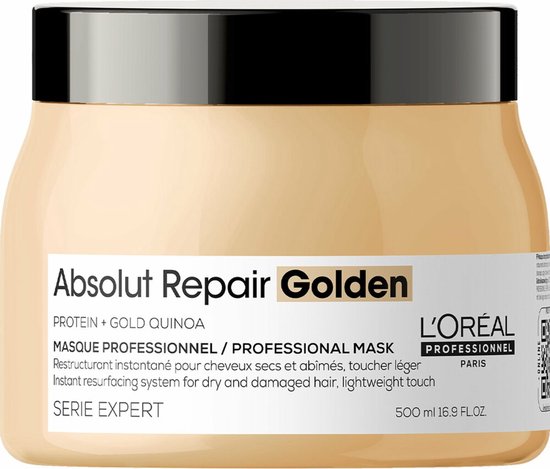 Beige L'Oréal Professionnel Absolut Repair Golden haarmasker pot met zwart deksel en gouden label.