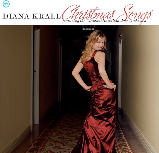 Diana Krall, 'Christmas Songs'-albumhoes. Vrouw in rode satijnen jurk.