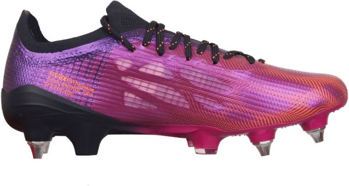 Puma Unisex Voetbalschoenen Ultra 1.4 MXSG, maat 43, met textiele bovenkant en vetersluiting in paarse en roze kleuren.