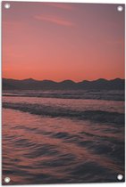 WallClassics - Tuinposter – Golvende Zee met Oranje Paarse Lucht - 50x75 cm Foto op Tuinposter (wanddecoratie voor buiten en binnen)