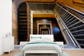 Behang - Fotobehang Historisch trappenhuis bij Ellis Island in New York Amerika - Breedte 600 cm x hoogte 400 cm