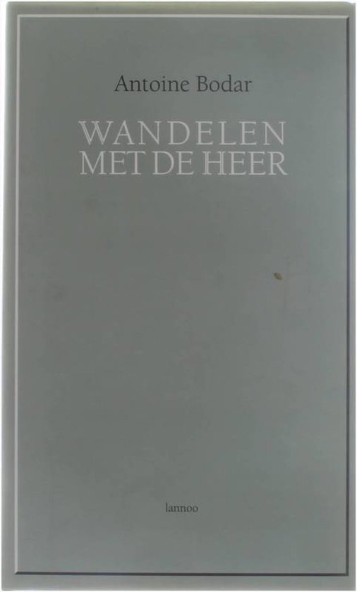 Boek "Wandelen Met De Heer" van Antoine Bodar met Lannoo logo.