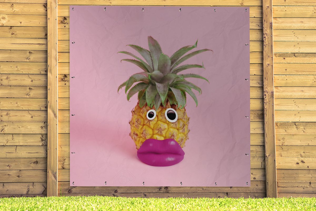 pineapple with face made of fake lips and googly eyes