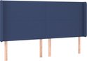 Tête de lit bleue en tissu avec des ailes, avec quatre coutures verticales.