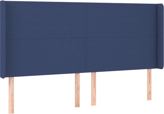 Tête de lit bleue en tissu avec des ailes, avec quatre coutures verticales.