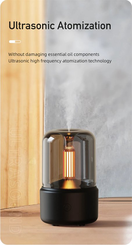 Zwarte diffuser met een glazen kap, met een gloeiende lamp en de tekst 'ULTRASONIC ATOMIZATION'.