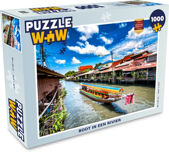 Boîte d'un puzzle de 1000 pièces montrant un bateau sur une rivière, avec le texte 'Boot in een rivier'