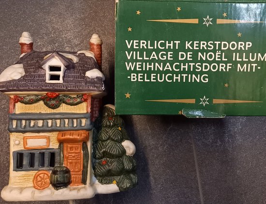 Kerstdorp landhuis met verlichting