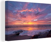 Canvas Schilderij Een kleurrijke zonsondergang bij de zee - 60x40 cm - Wanddecoratie