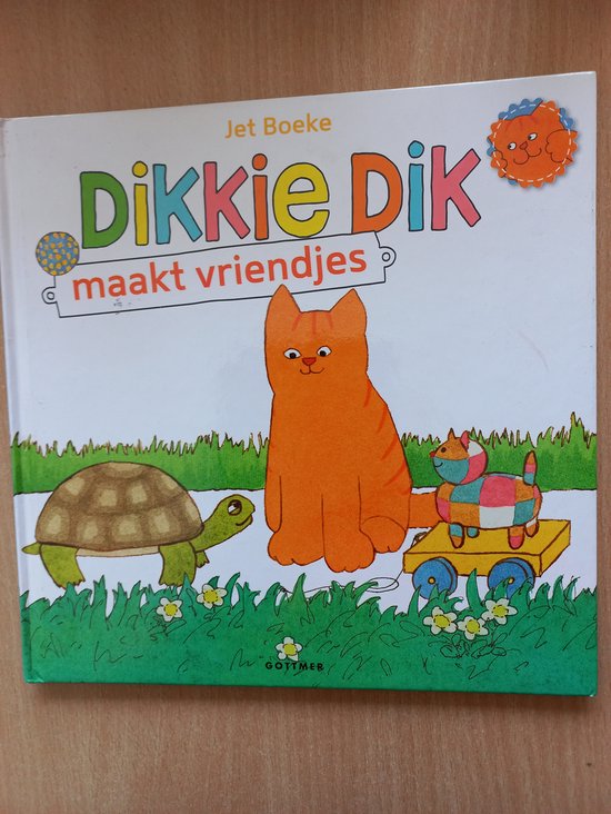 Dikkie Dik maakt vriendjes: een oranje kat, een schildpad en een speelgoedje in een treintje. Door Jet Boeke.