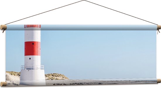 WallClassics - Textielposter - Vuurtoren met Rotsen aan de Zee - 90x30 cm Foto op Textiel