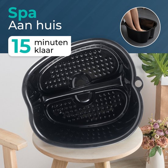 Zwart voetenbad met noppen en een ingebouwd deel voor de voeten.