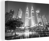 Tableau sur toile Les tours Petronas illuminées la nuit - noir et blanc - 60x40 cm - Décoration murale