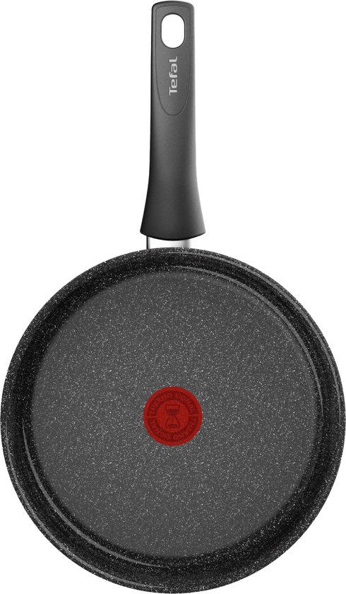 Bodem van een zwarte Tefal koekenpan met granite-look coating en rode thermospot indicator.