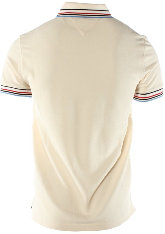 Crème poloshirt met korte mouwen, Tommy Hilfiger '95 logo en gestreepte kraag en mouwen.